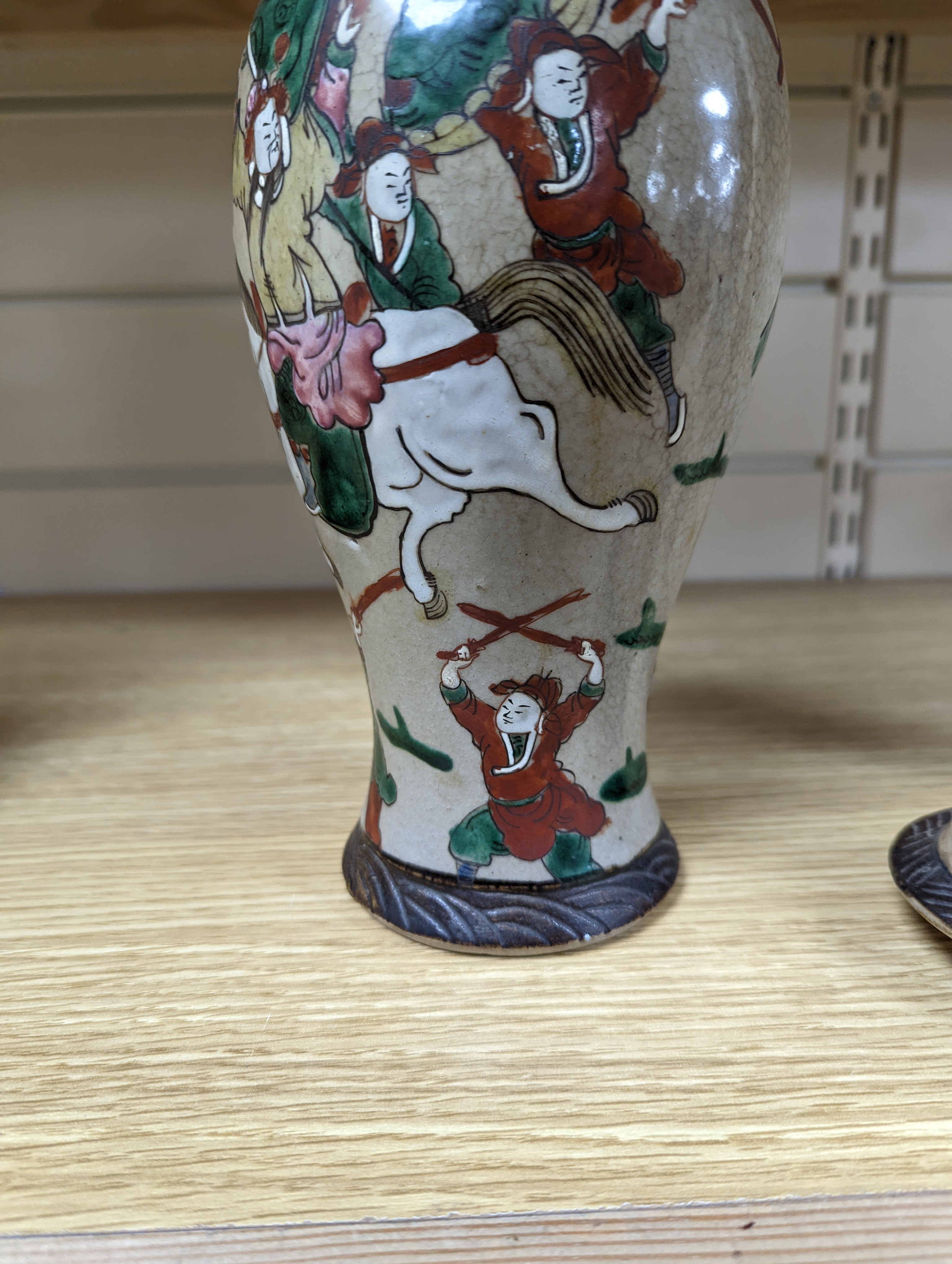 A late 19th century Chinese crackle glaze famille rose baluster vase and cover 30cm